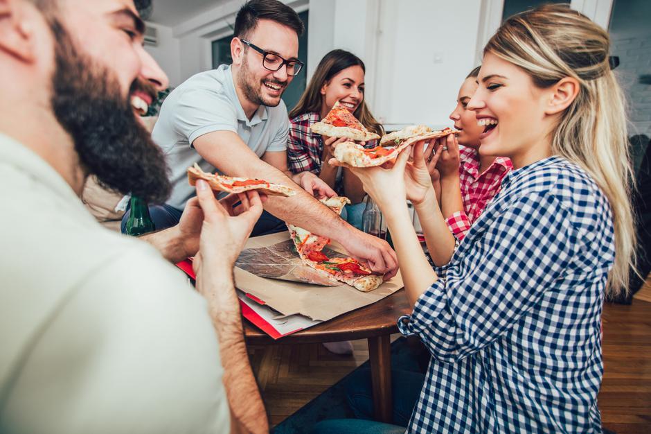 Group,Of,Young,Friends,Eating,Pizza.home,Party.fast,Food,Concept. | Author: Press