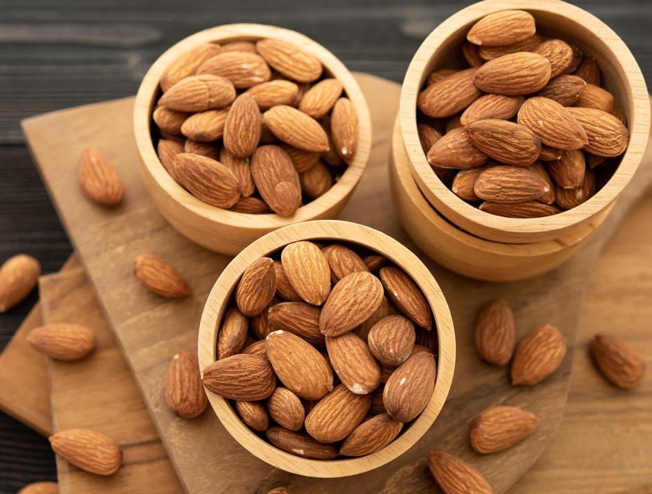 Bowl with almond on a wooden table. (selective focus; close-up s | Author: Infocuspix