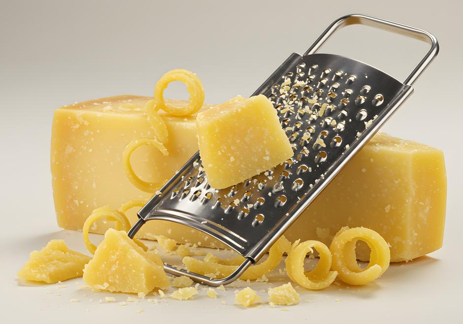 Cheese blocks with grater showcasing preparation of various food ingredients | Author: Ramdhaniyah Mumtazah / Vecteezy
