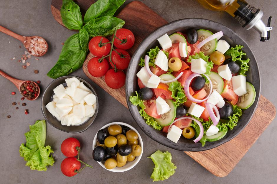 Classic greek salad of fresh vegetables, cucumber, tomato, sweet | Author: Jcomp / Freepik